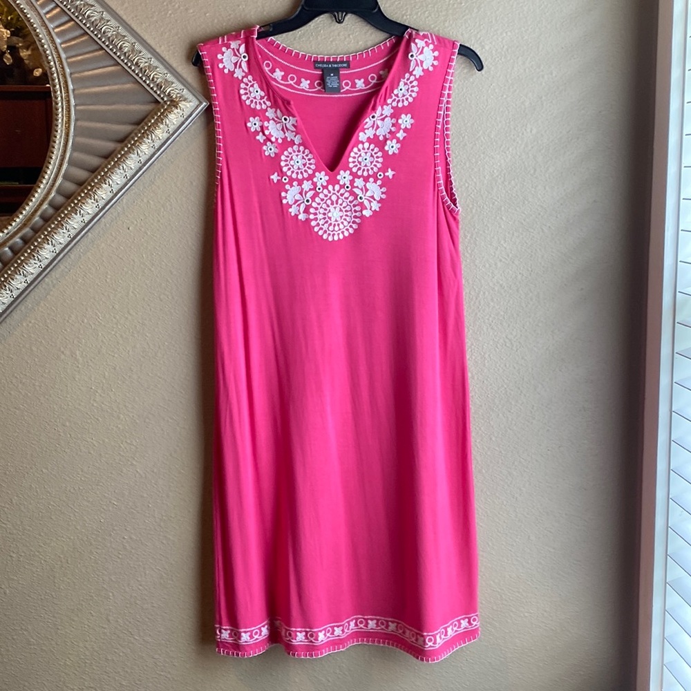 Hot pink Embroidered color and embroidered rim at the bottom of dress.